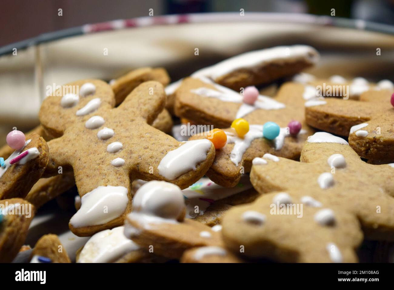 Sweet gingerbread homemade figurines for Christmas decorated with white