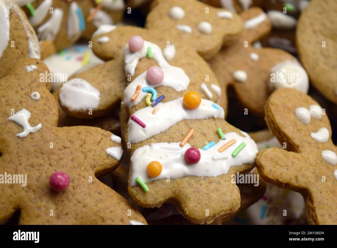 Sweet gingerbread homemade figurines for Christmas decorated with white