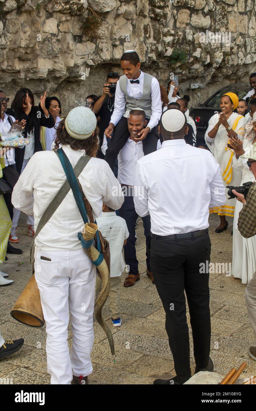 10 Nov 2022 Family and friends enjoying Bar Mitzvah celebrations near the Jaffa Gate as the party makes its way to the Western Wall and the Temple Mou Stock Photo
