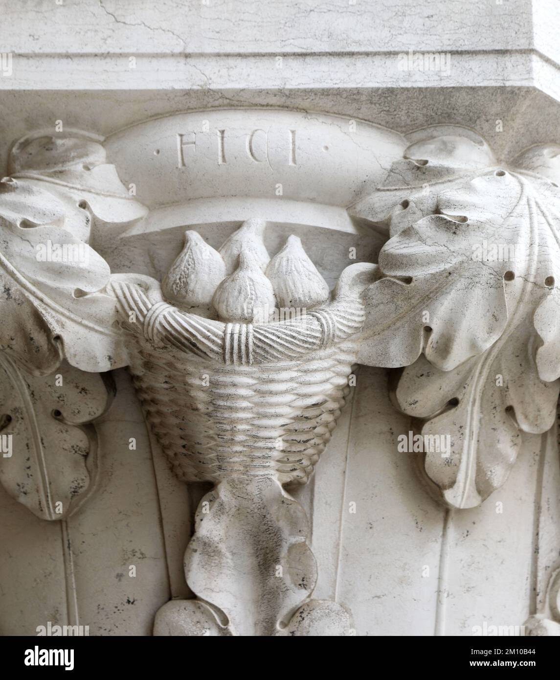 Sculpture with the writing FICI which means FIGS in Venetian dialect in Venice on a column of the Doge's Palace Stock Photo