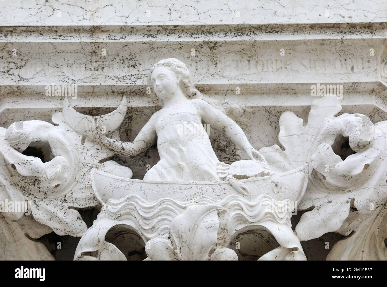 Ancient Sculpture Symbolizing The Creation Of The Moon On A Column Of Ancient sculpture symbolizing the creation of the moon on a column of