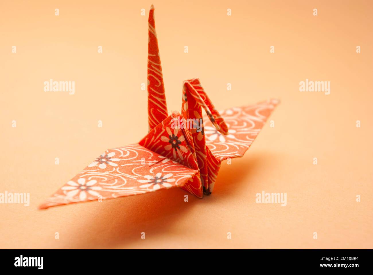 Paper crane traditionally folded according to the Japanese art of origami. Stock Photo