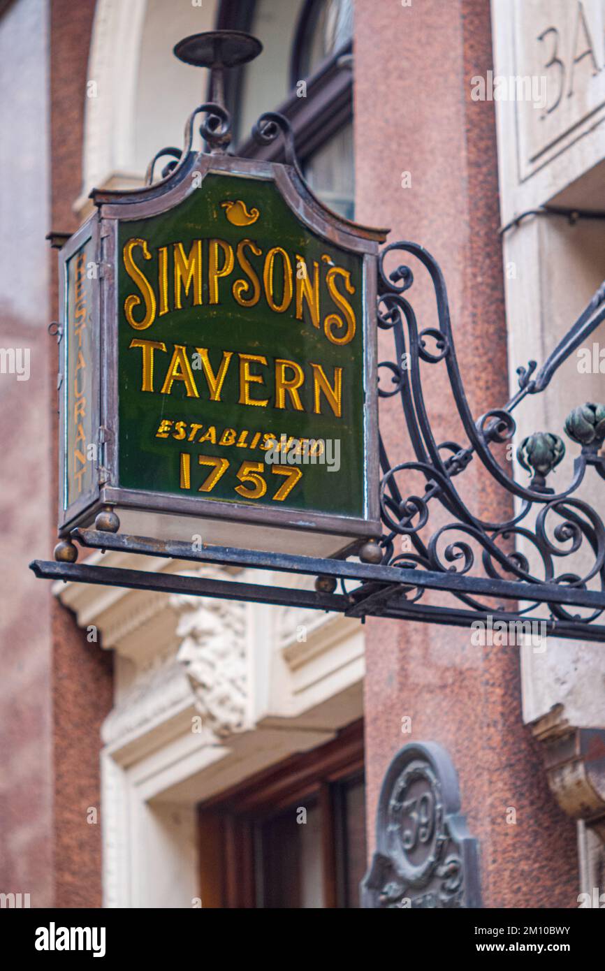Simpsons Tavern sign at Ball Court, Cornhill in the City of London Financial District. The tavern was founded in 1757 on its current site. Stock Photo