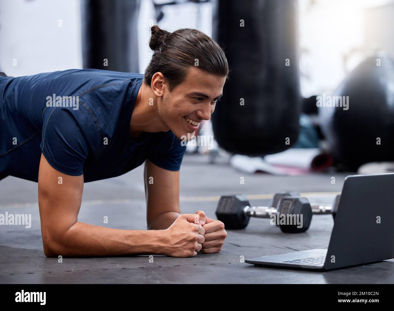 Exercise, laptop and personal trainer do virtual workout video on streaming or watching