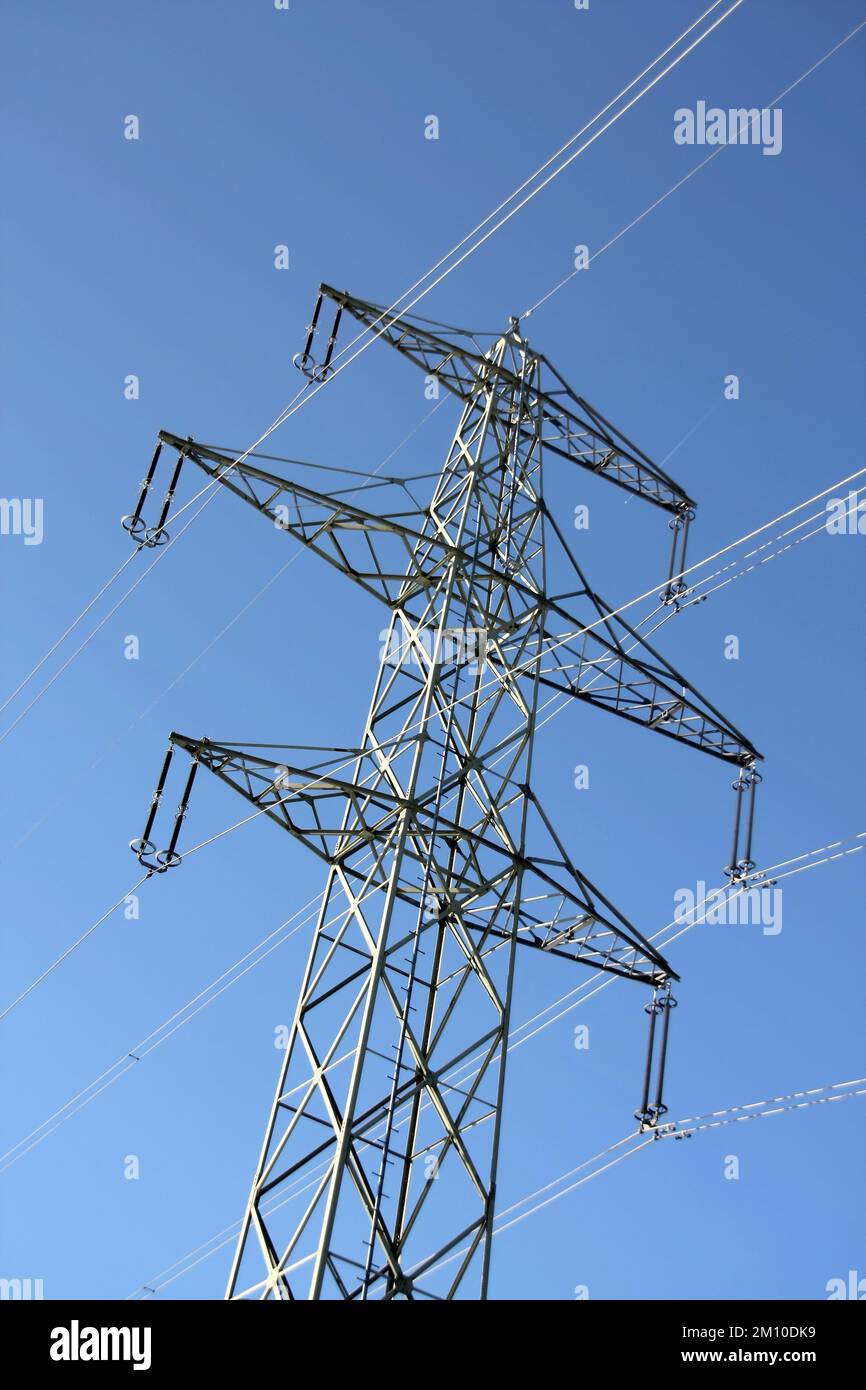 high voltage electricity pylon with blue sky and cloud Stock Photo - Alamy