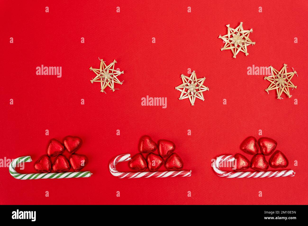 Christmas background with a sled, candy and a caramel cane Stock Photo