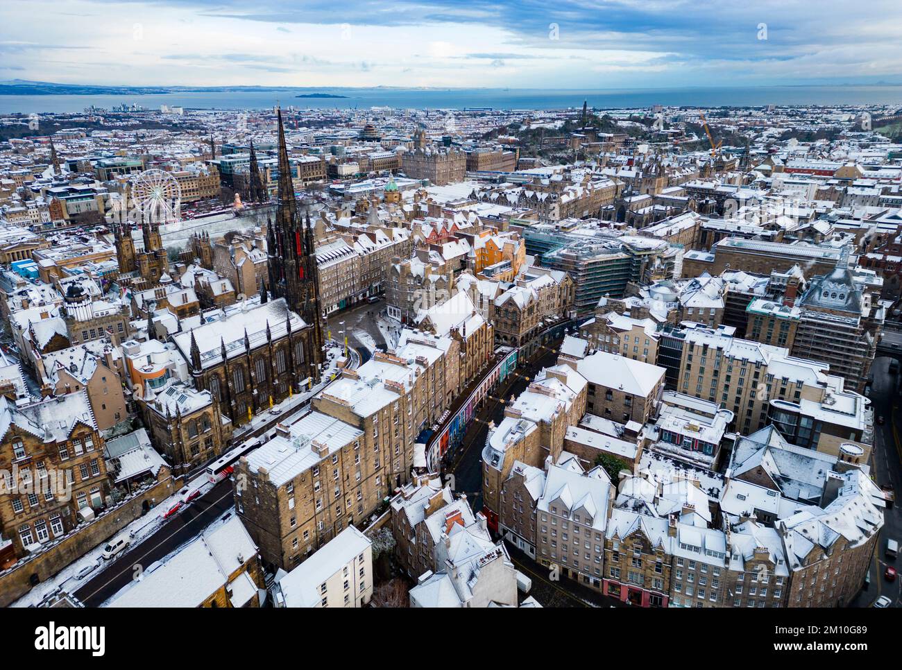 Aerial view of winter snow covered rooftops in Edinburgh Old Town