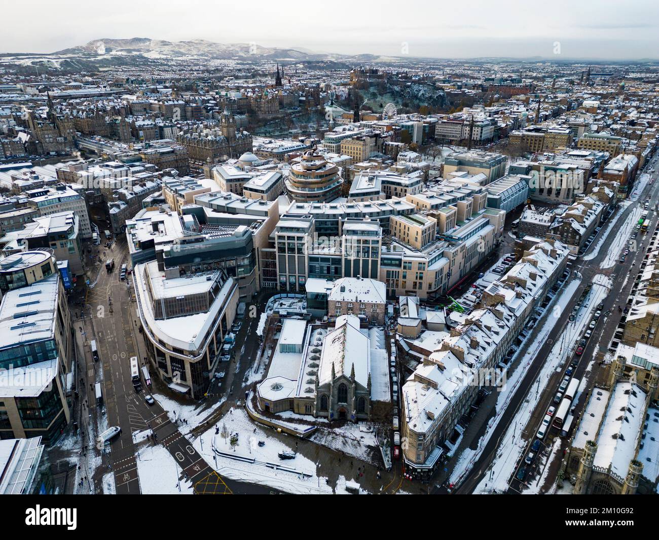 Aerial view of winter snow covered rooftops and St James Quarter in