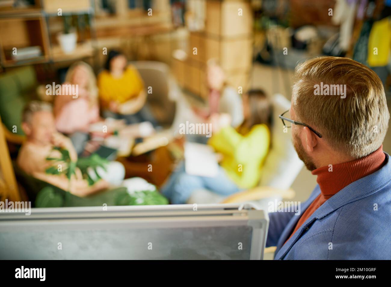 Project manager working with employees, co-workers on new projects, having meeting, discussion at the office, indoors. Concept of business Stock Photo