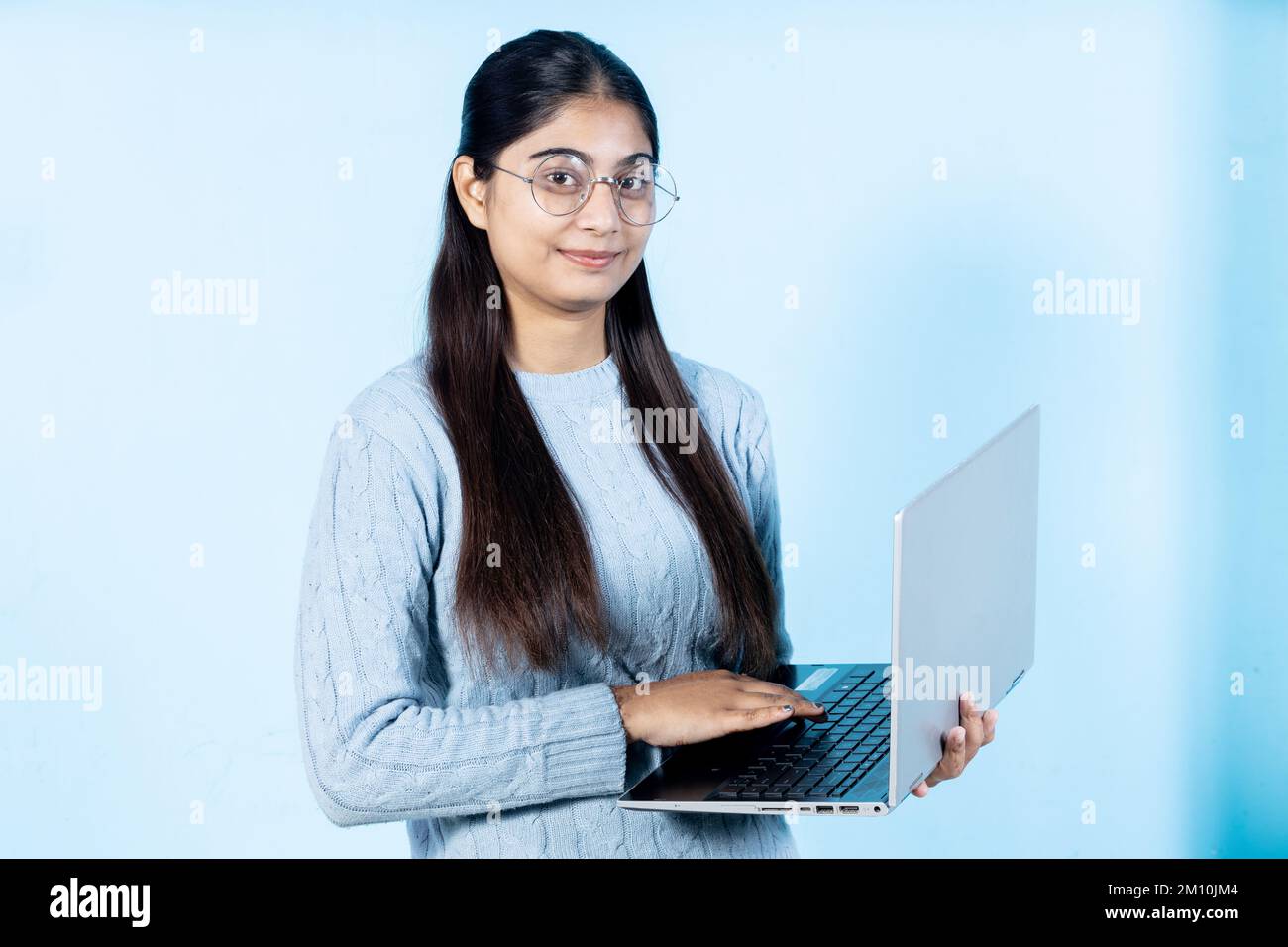 indian young student girl holding book Stock Photo - Alamy