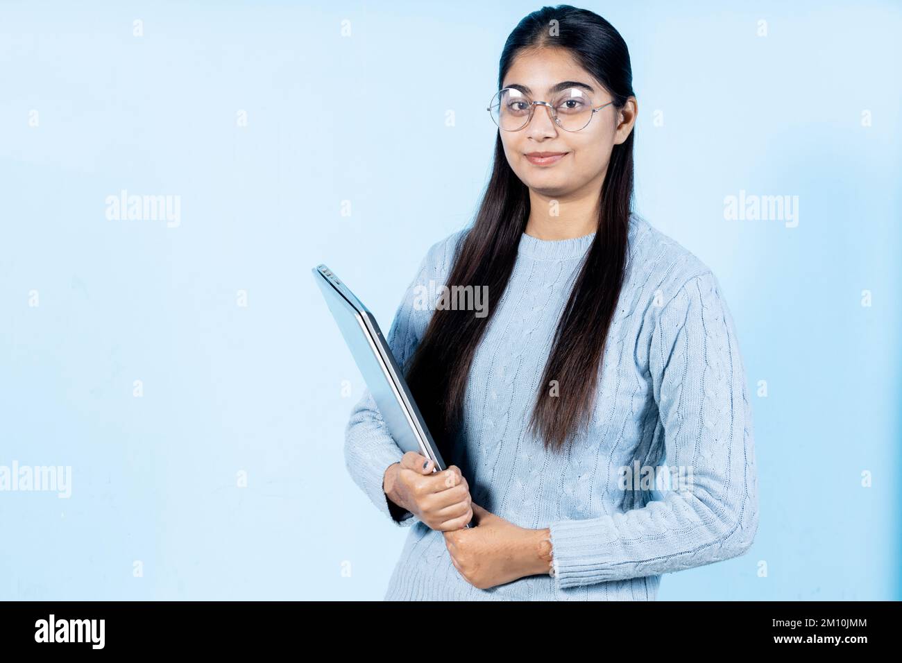 indian young student girl holding book Stock Photo - Alamy
