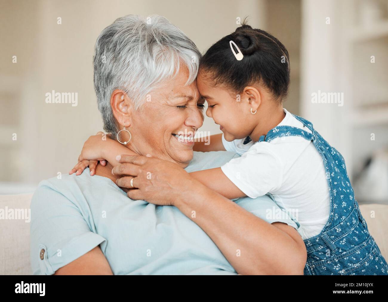 My family is my life. a grandmother and granddaughter bonding on the sofa at home. Stock Photo
