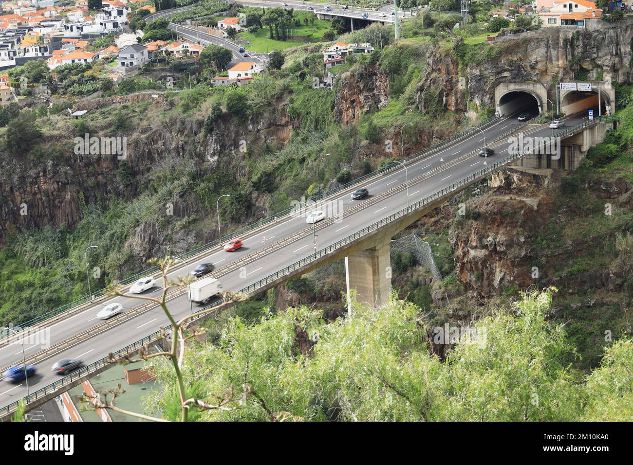 Funchal, Madeira - Aerial view of cars speeding along the Via a Cota 200 or VR1 motorway towards a section of tunnel Stock Photo