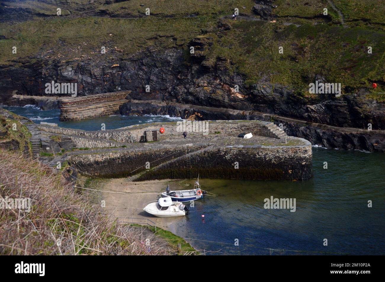 Two Wooden Fishing Boats on the River Valency in the Harbour in Boscastle on the South West Coastal Path in Cornwall, England, UK. Stock Photo