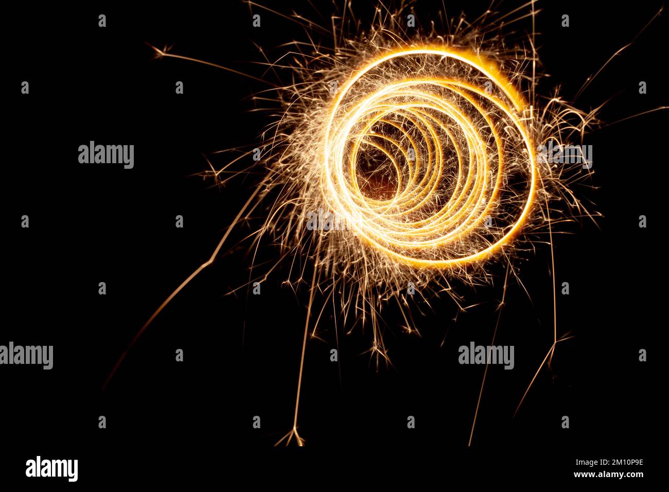 Circles with sparks on a black background. Festive sparklers, New Year's abstract lights Stock Photo