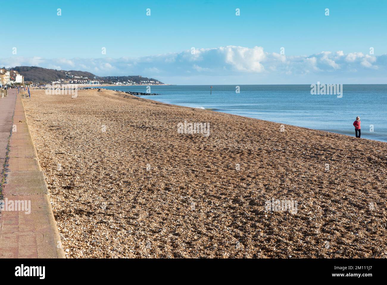 An almost deserted Hythe beach along West parade. Stock Photo