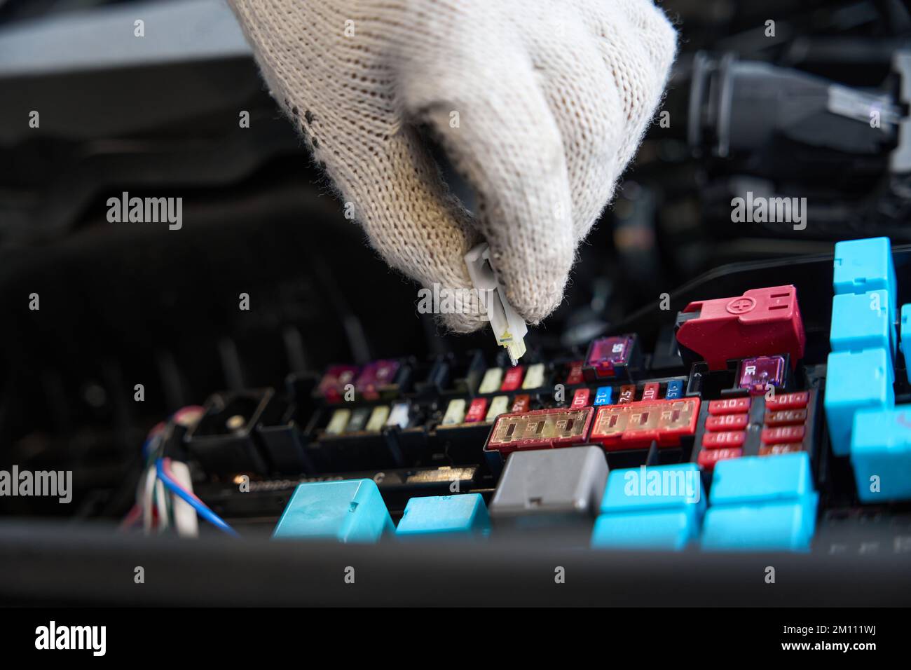 Close Up Photo Of Worker Checking Parts Of Automobile Stock Photo - Alamy