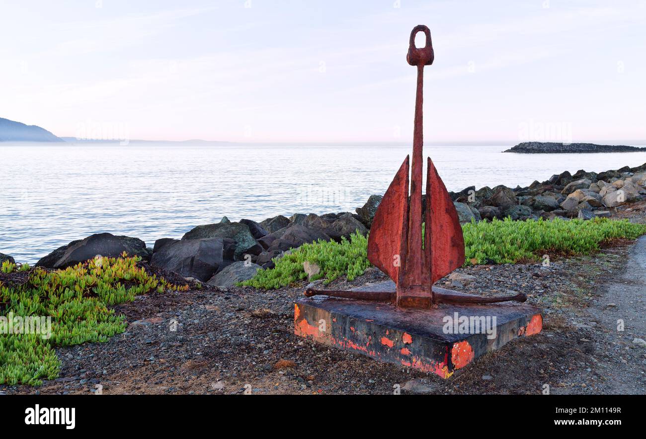Classic 'Danforth'  fluke-style boat anchor,  overlooking Pacific Ocean. Stock Photo