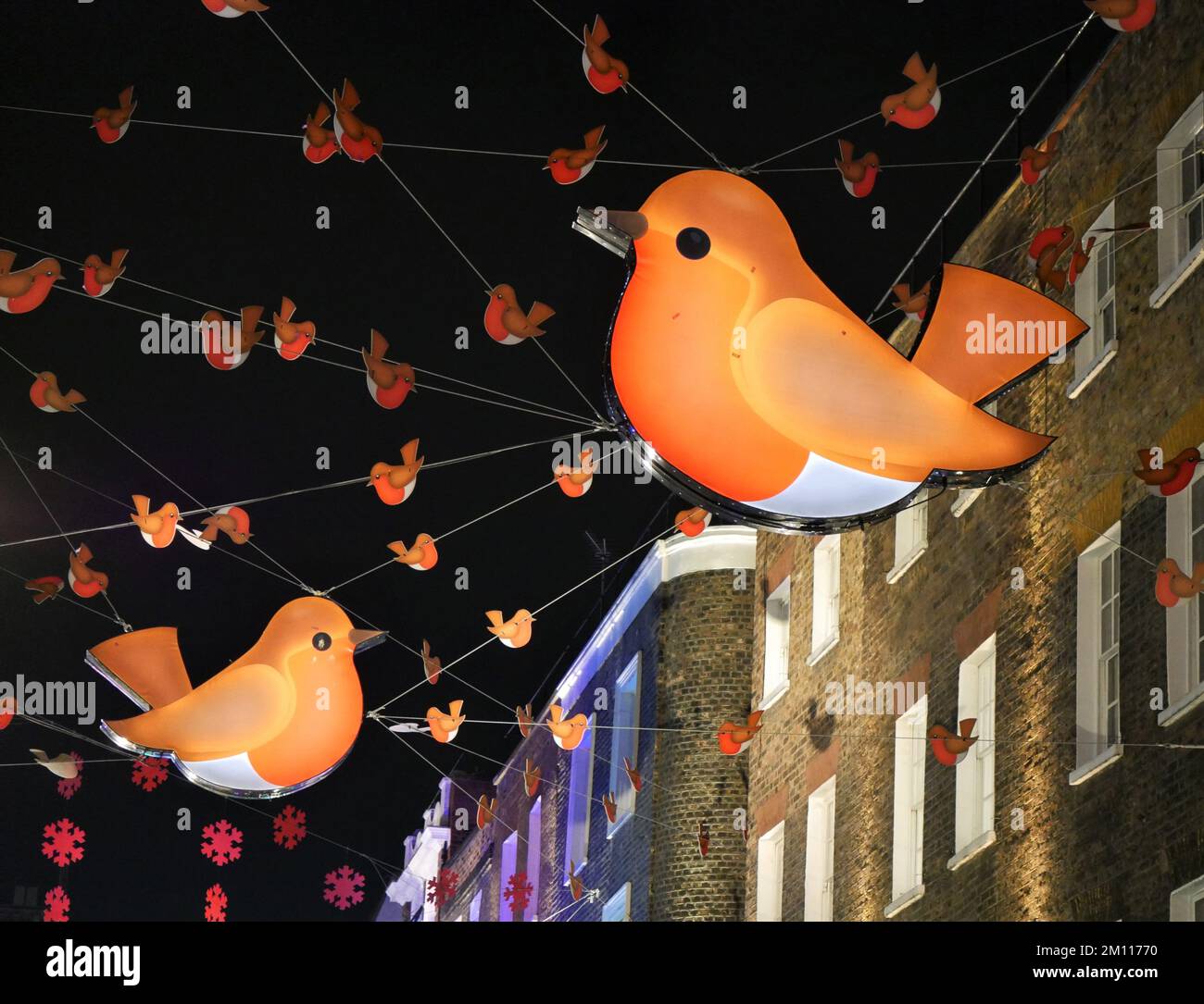 Robin Christmas decorations in Carnaby Street, London. Stock Photo