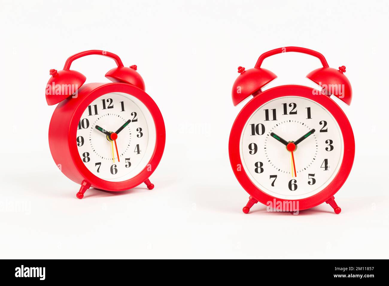 red alarm clock on white background Stock Photo Alamy