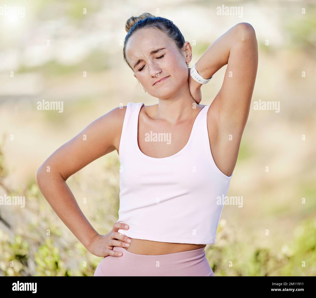 Woman, neck pain or muscle stress in fitness, workout or training in nature park, countryside environment or public garden. Runner, sports athlete or Stock Photo