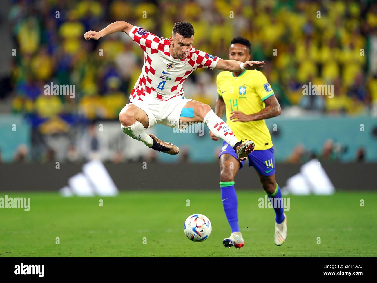 Croatia's Ivan Perisic (left) and Brazil's Eder Militao battle for the ball during the FIFA World Cup Quarter-Final match at the Education City Stadium in Al Rayyan, Qatar. Picture date: Friday December 9, 2022. Stock Photo