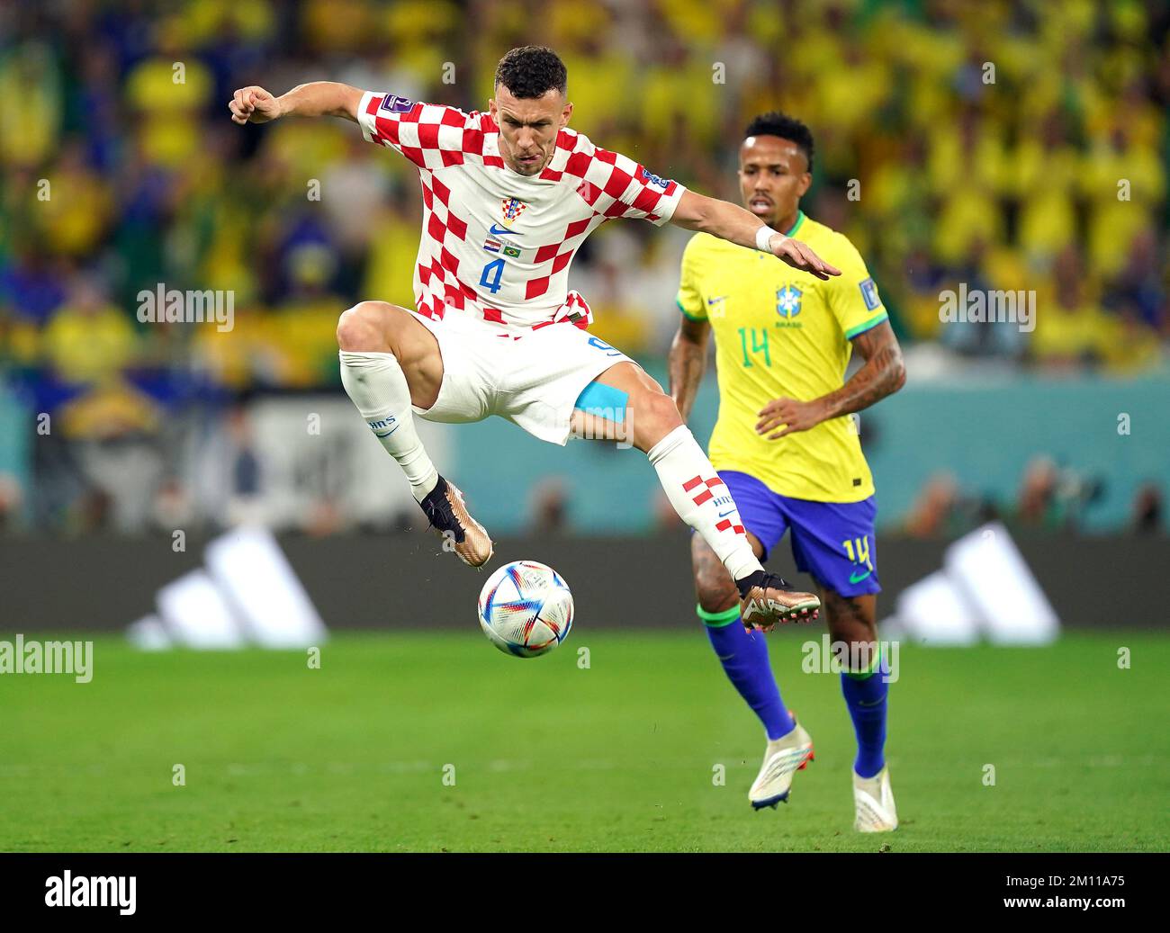 Croatia's Ivan Perisic (left) and Brazil's Eder Militao battle for the ball during the FIFA World Cup Quarter-Final match at the Education City Stadium in Al Rayyan, Qatar. Picture date: Friday December 9, 2022. Stock Photo