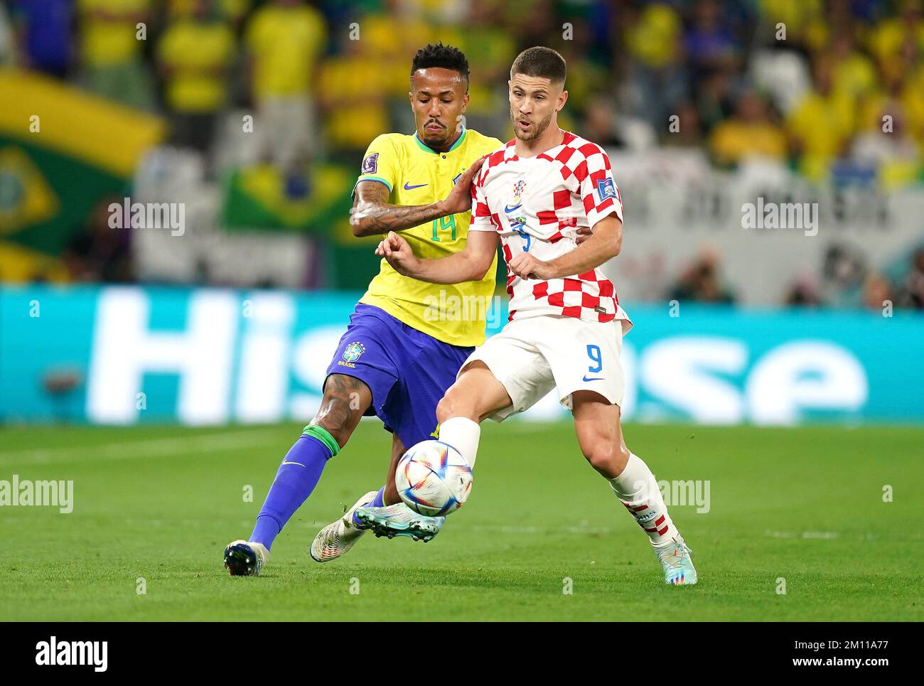 Brazil's Eder Militao (left) and Croatia's Ivan Perisic battle for the ball during the FIFA World Cup Quarter-Final match at the Education City Stadium in Al Rayyan, Qatar. Picture date: Friday December 9, 2022. Stock Photo