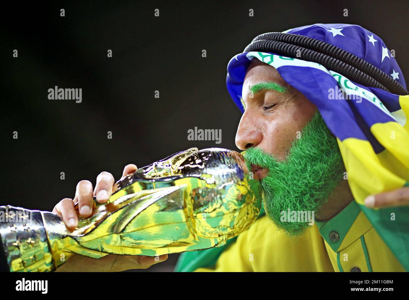 Brazil fan kisses the World Cup trophy during the FIFA World Cup Qatar 2022 match, Quarter Final, between Croatia v Brazil played at Education City Stadium on Dec 9, 2022 in Doha, Qatar. (Photo by Heuler Andrey / DiaEsportivo / PRESSIN) Stock Photo