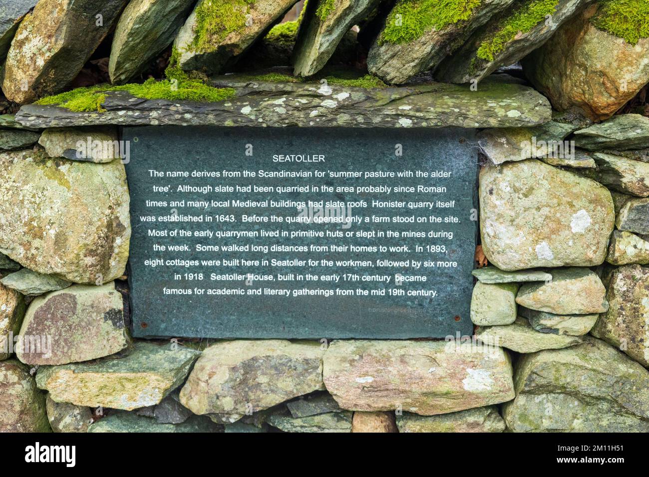 Seatoller is a small village in Borrowdale in the Lake District National Park. A slate information board Stock Photo
