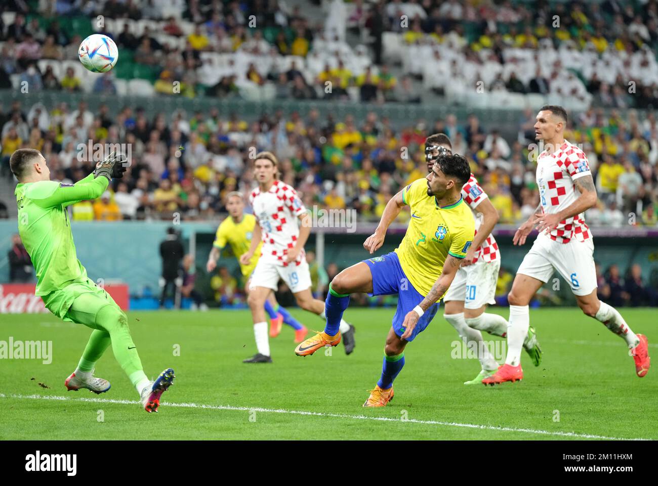 Croatia goalkeeper Dominik Livakovic saves a shot from Brazil's Lucas Paqueta during the FIFA World Cup Quarter-Final match at the Education City Stadium in Al Rayyan, Qatar. Picture date: Friday December 9, 2022. Stock Photo