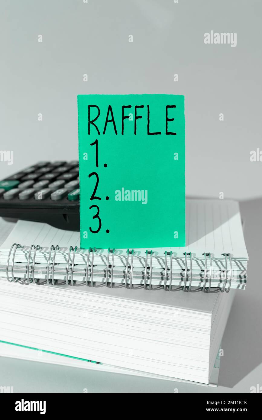 Text sign showing Raffle. Word for means of raising money by selling numbered tickets offer as prize Stock Photo
