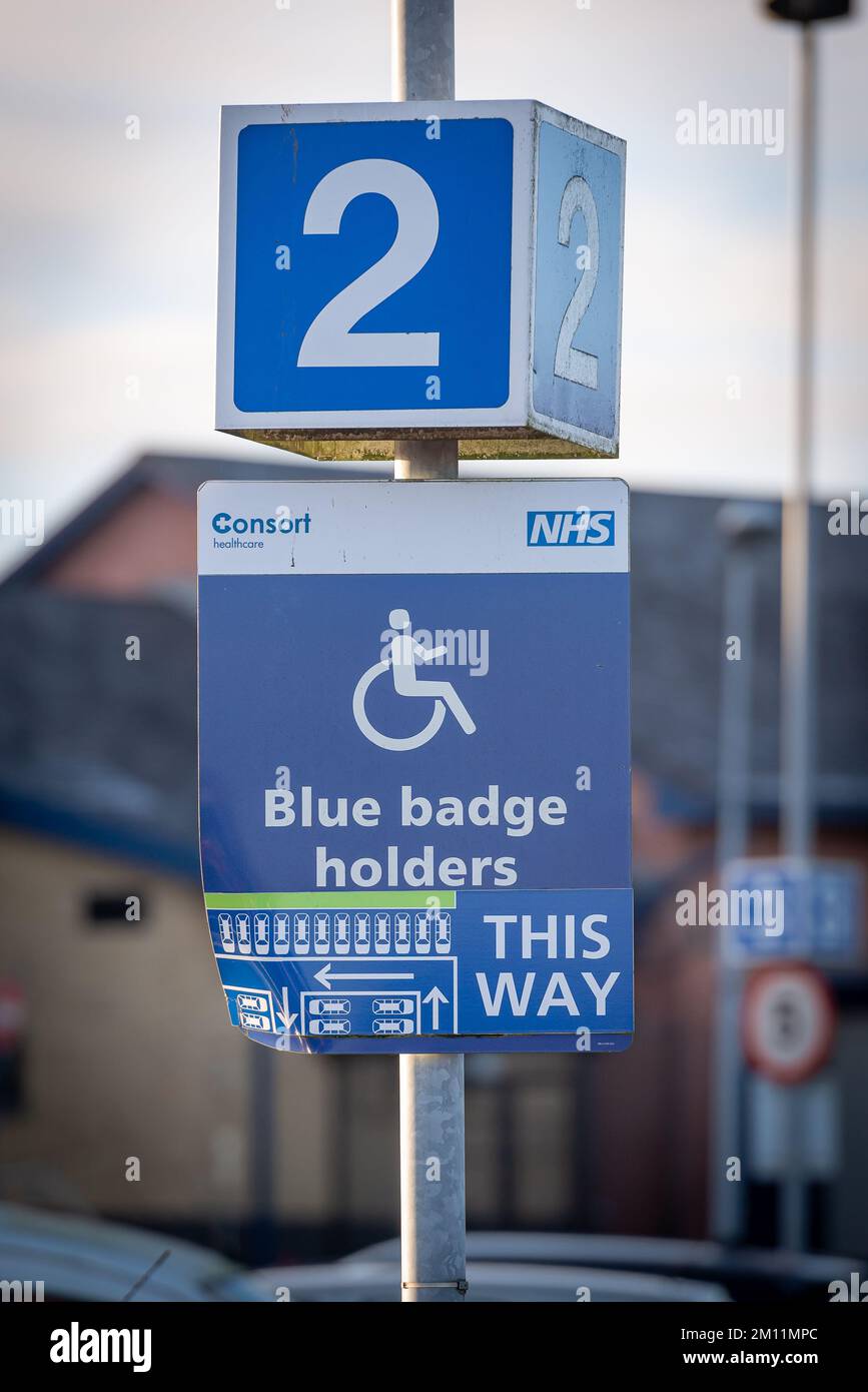 Taken at Royal Blackburn Teaching Hospital, Blackburn, Lancashire, UK on 9 Dec 2022. Sign on lamp post for blue badge holders. Zone 2 parking lot Stock Photo