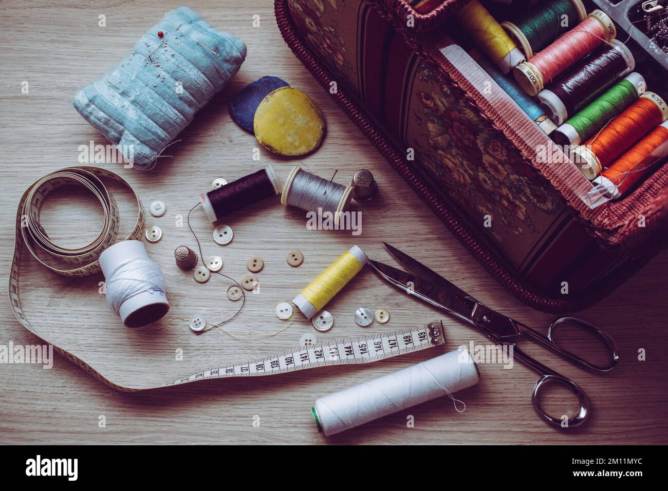 some of the tools needed to sew on a table Stock Photo Alamy