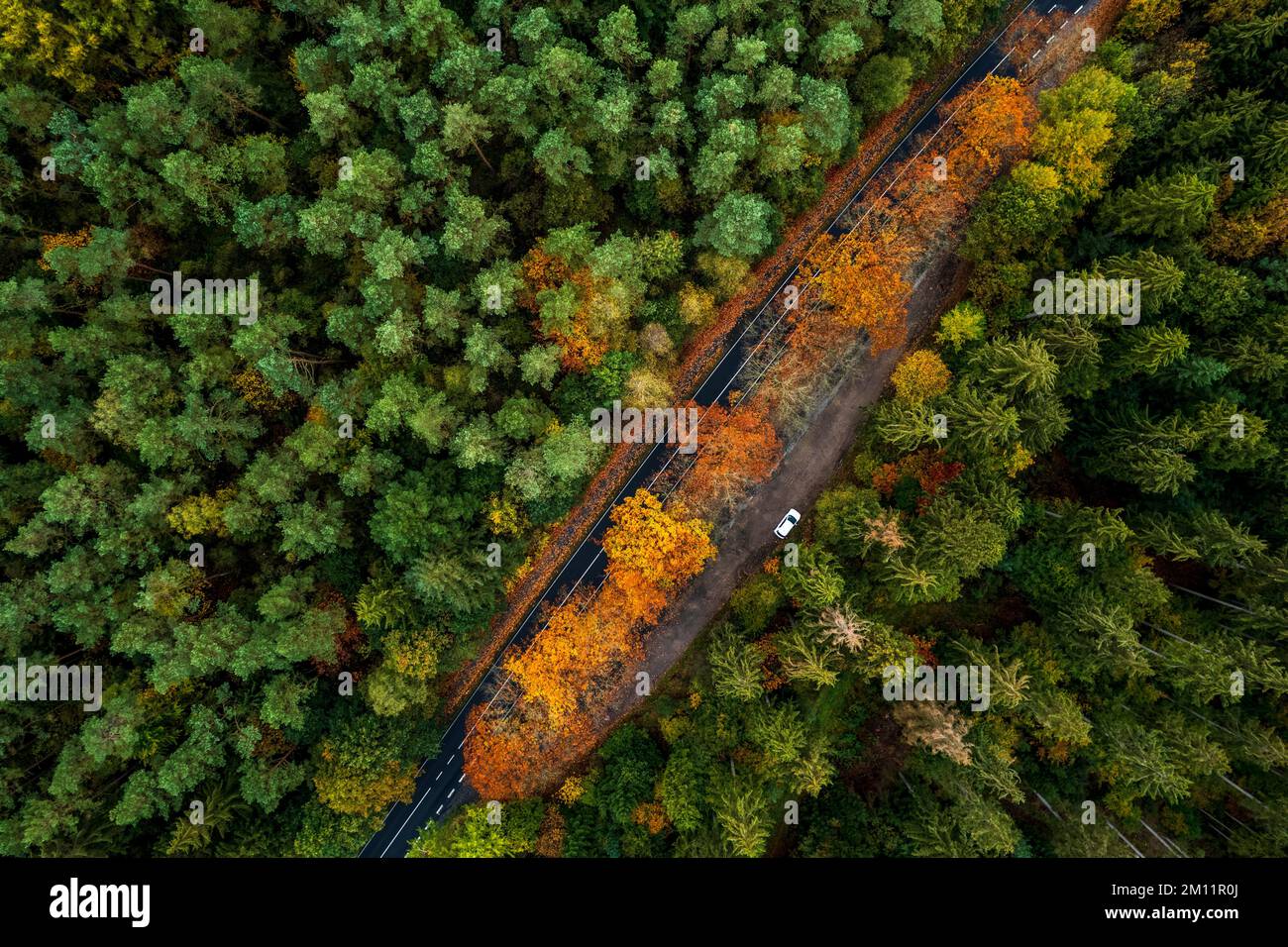 Aerial view, drone shot, vertical view, parking lot at a county road ...