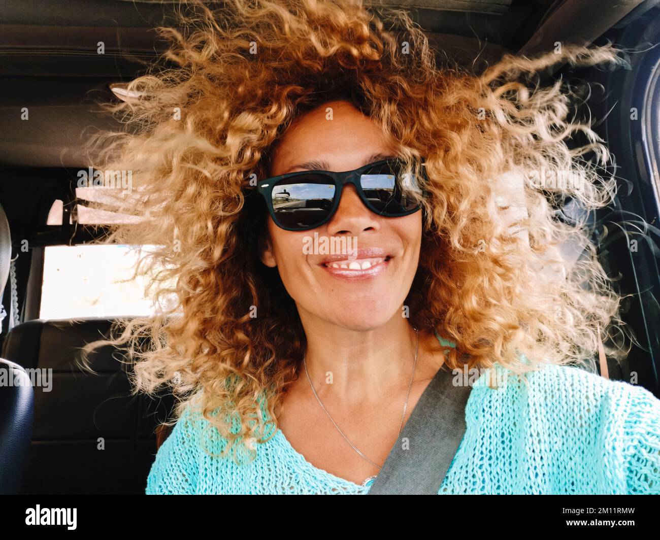 Woman long curly hair blowing hi-res stock photography and images - Alamy