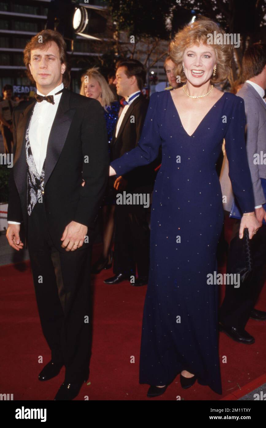 Kathleen Turner and Jay Weiss at the 59th Annual Academy Awards March