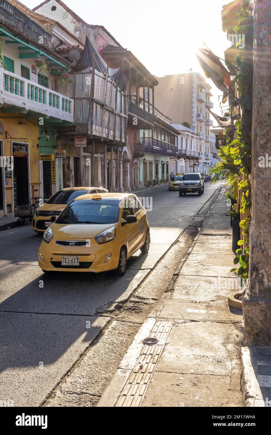 South America, Colombia, Departamento de Bolívar, Cartagena de Indias, Barrio Getsemaní, cabs on a street in Cartagena Stock Photo