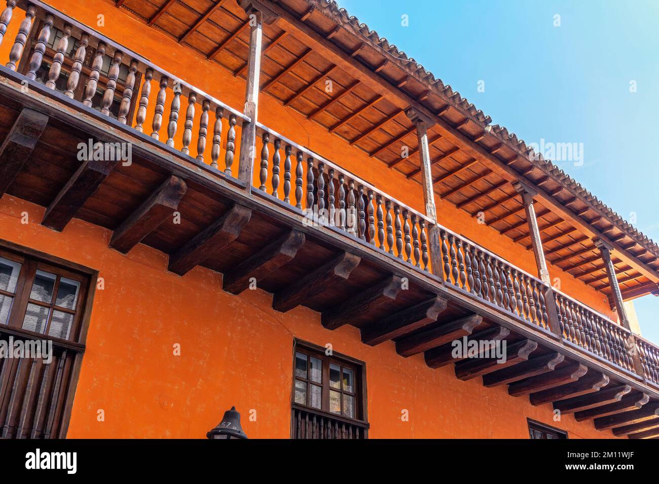 South America, Colombia, Departamento de Bolívar, Cartagena de Indias, Ciudad Amurallada, Orange facade in the historic old town of Cartagena Stock Photo