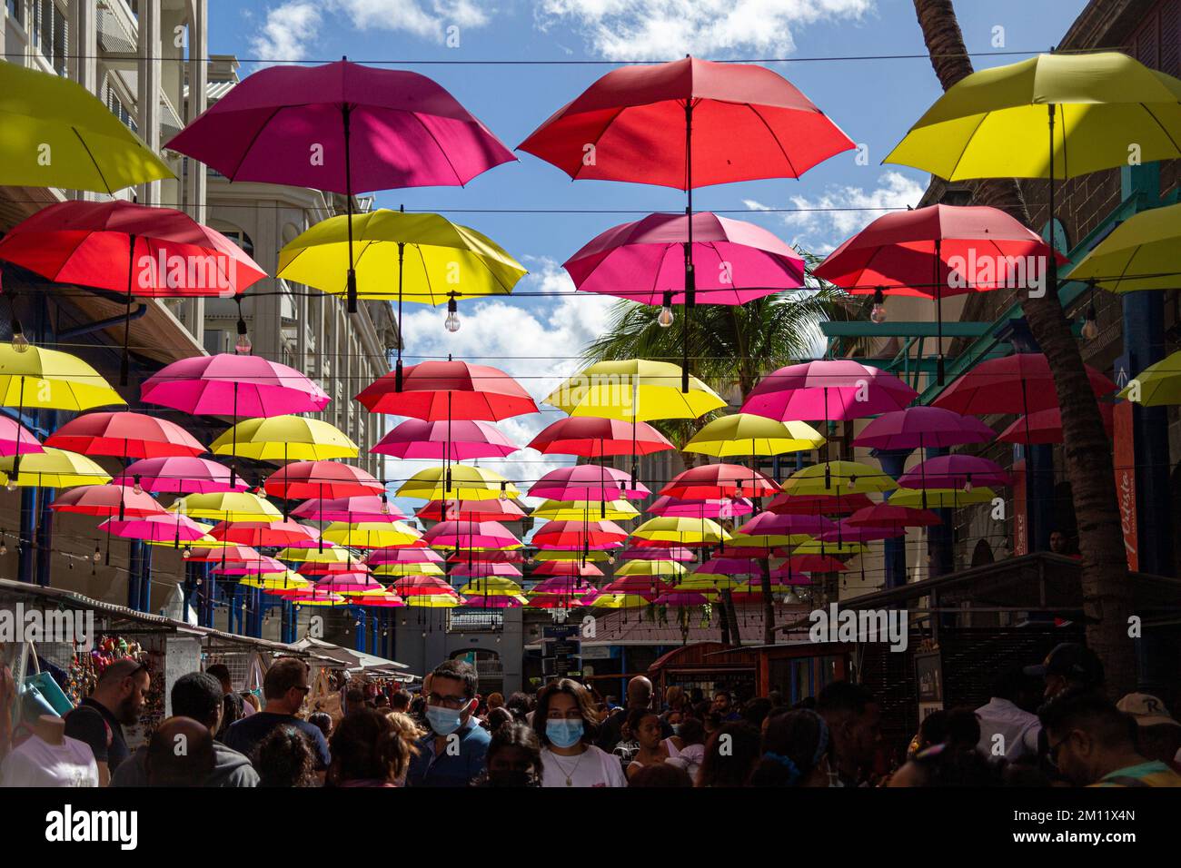Umbrellas lining Caudan Waterfront commercial development in Port