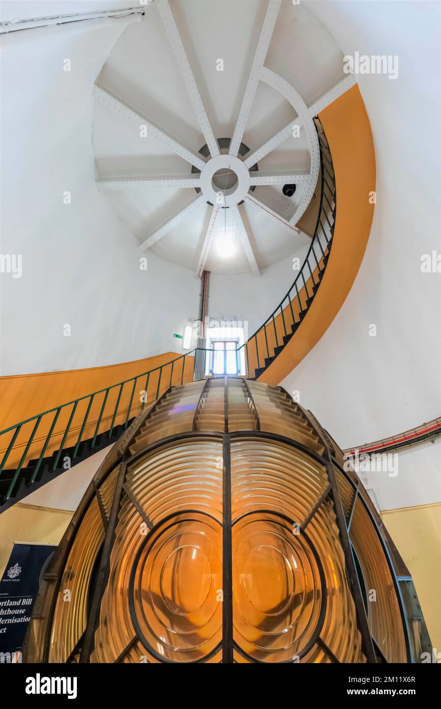 England, Dorset, Weymouth, Portland Bill, Portland Bill Lighthouse, Interior View of Circular Staircase and Historical Lighthouse Lamp Stock Photo