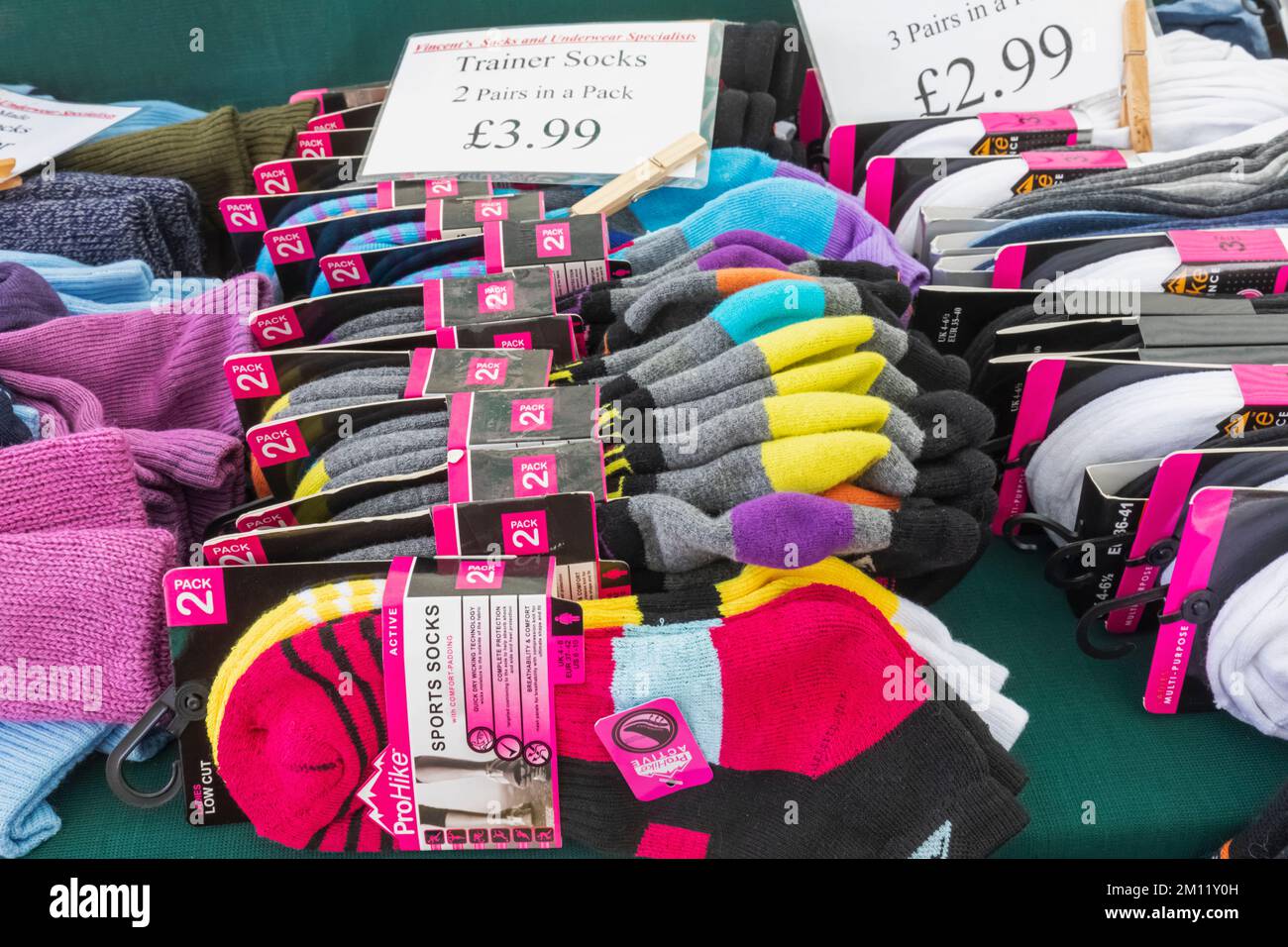 England, Dorset, Christchurch, Christchurch Market, Clothing Stall display of Socks Stock Photo