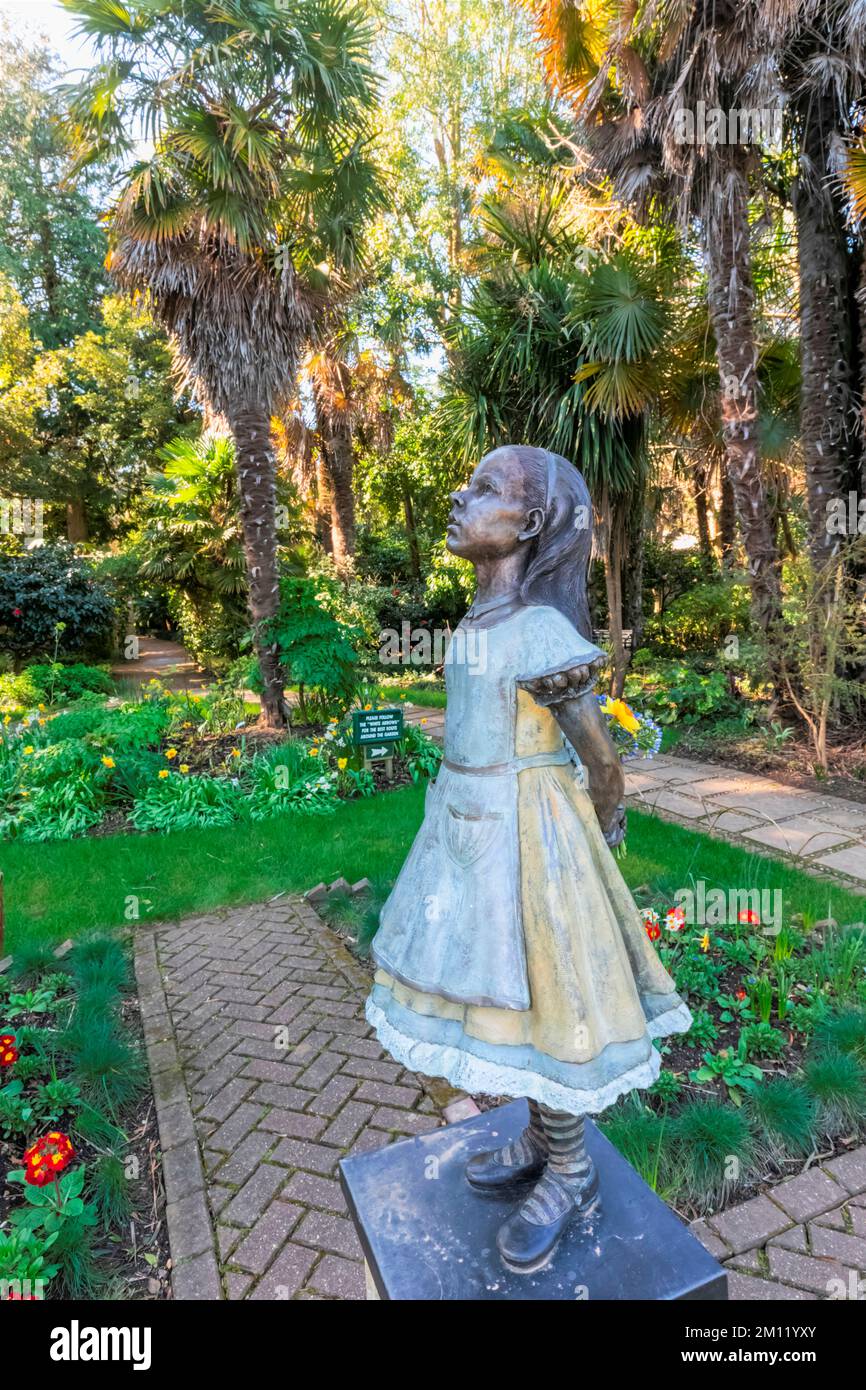 England, Dorset, Abbotsbury, The Subtropical Gardens, Statue of Alice in Wonderland Stock Photo