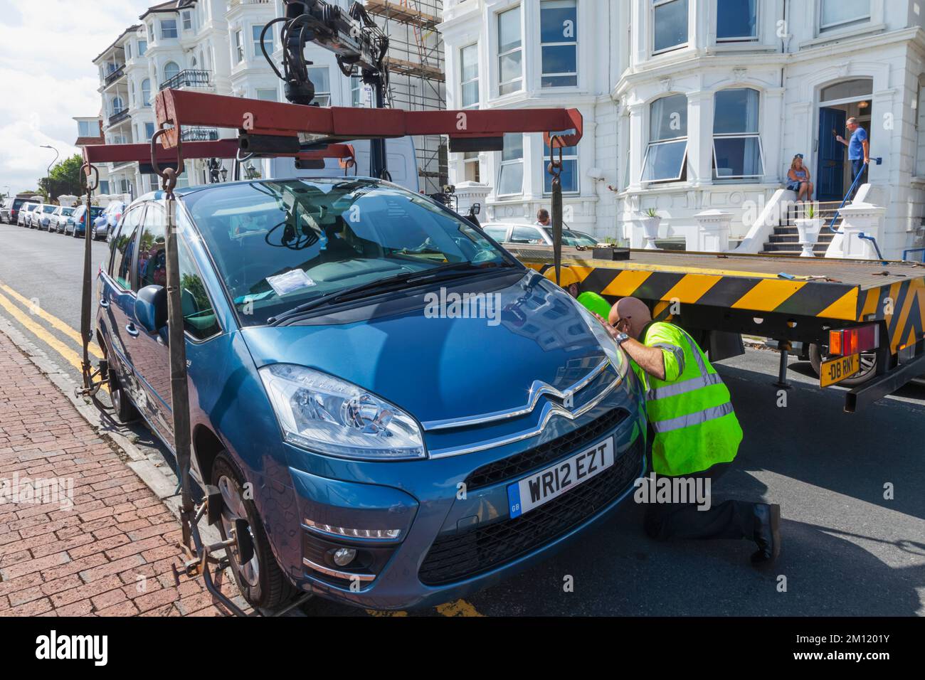 England, East Sussex, Eastbourne, Illegally Parked Car being Removed Stock Photo
