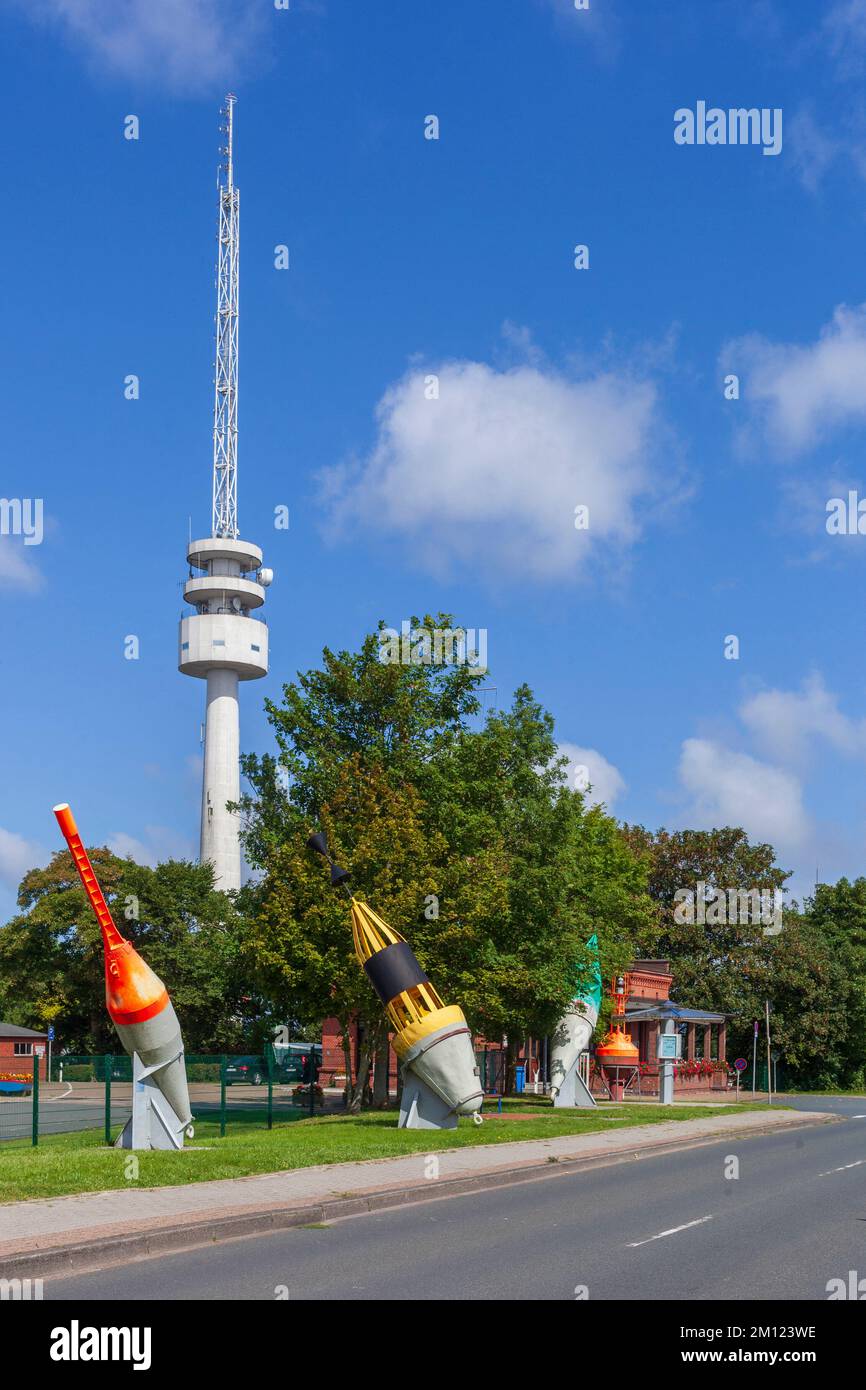 Colorful buoys at buoy yard with radar and antenna tower of WSA, Wilhelmshaven, Lower Saxony, Germany, Europe Stock Photo