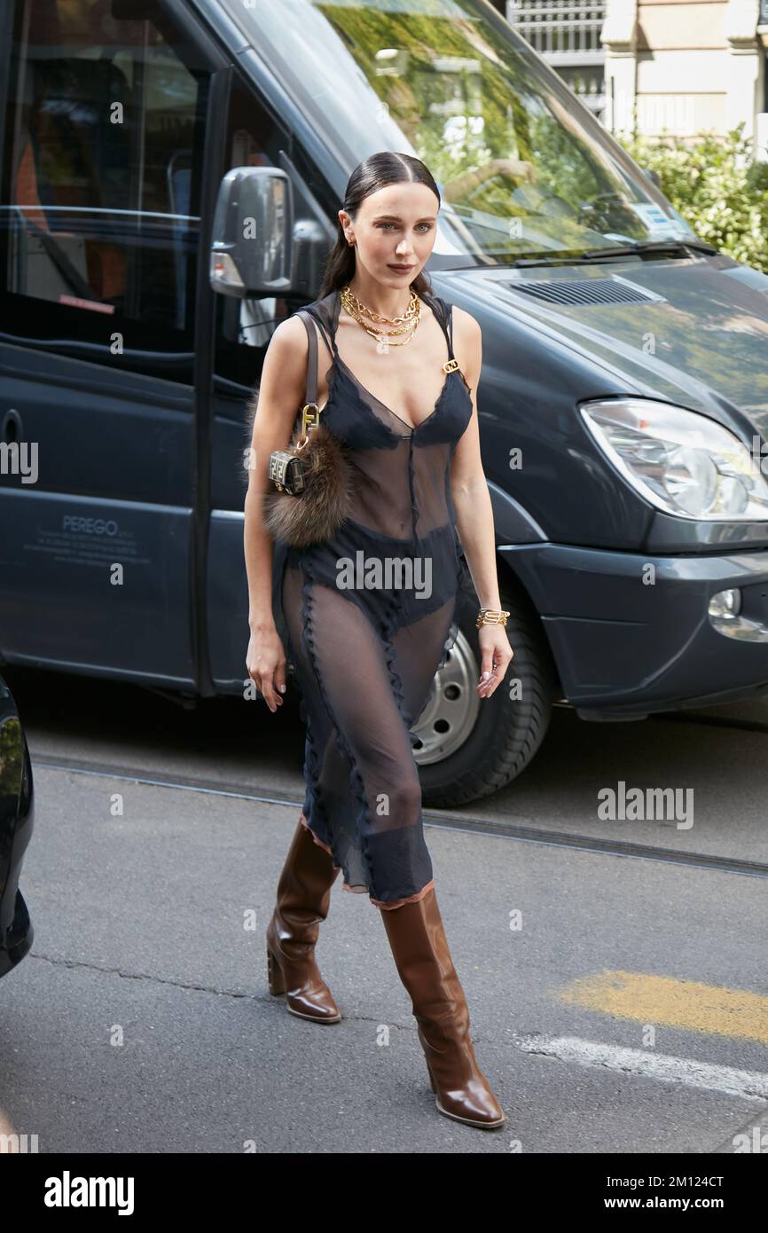 MILAN, ITALY - SEPTEMBER 21, 2022: Mary Leest with black transparent dressand Fendi bag with fur before Fendi fashion show, Milan Fashion Week street Stock Photo