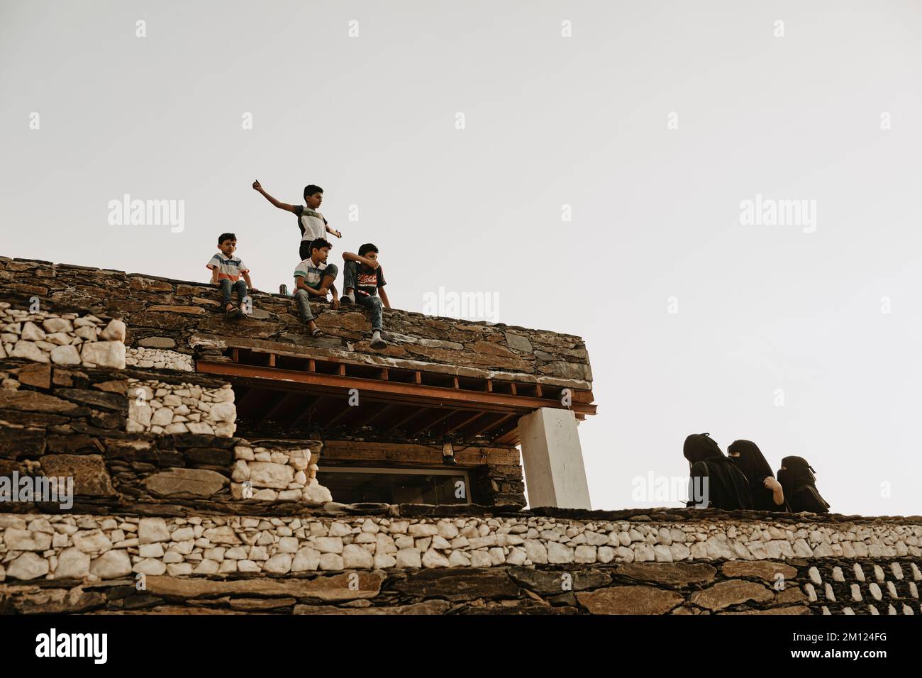 Saudi Arabia, Najran province, Najran, building, roof, children Stock Photo