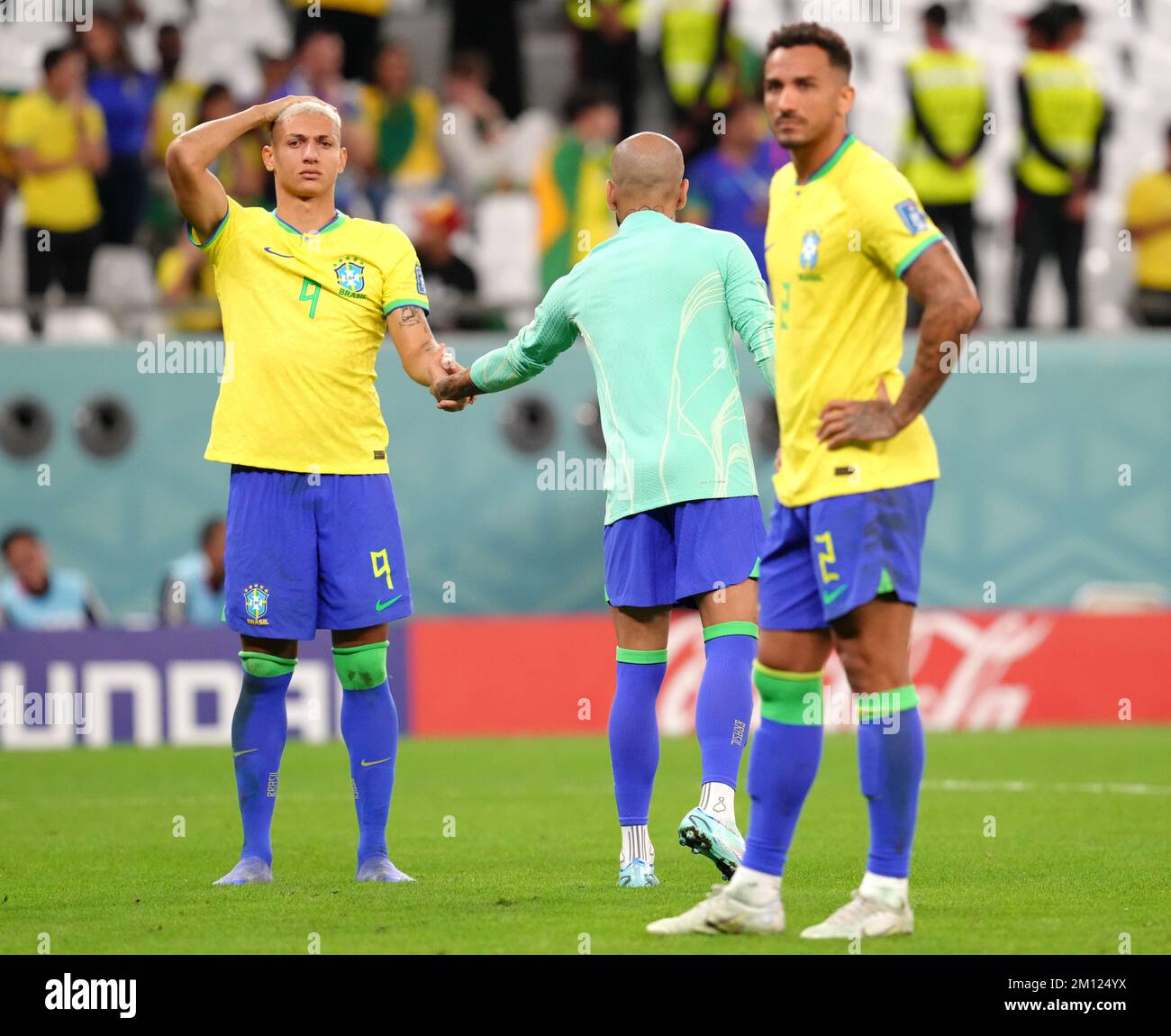 Brazil's Richarlison, Dani Alves and Danilo react to defeat in a penalty shoot-out following the FIFA World Cup Quarter-Final match at the Education City Stadium in Al Rayyan, Qatar. Picture date: Friday December 9, 2022. Stock Photo