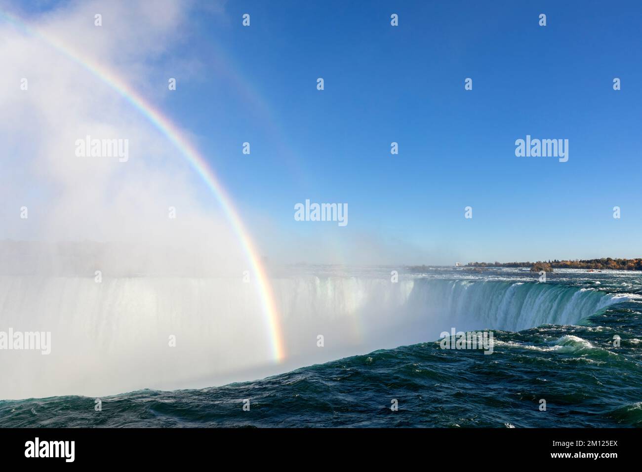 Canada, Ontario, Niagara Falls, The Horseshe Falls in daylight with a rainbow Stock Photo