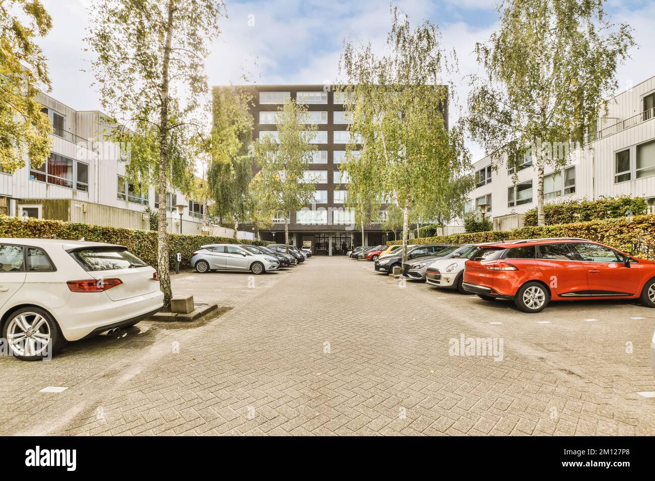Cars parked on both sides of the road hi-res stock photography and ...